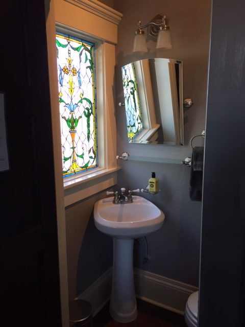 Private Lavatory Room with Stained Glass Window and Separate Vanity